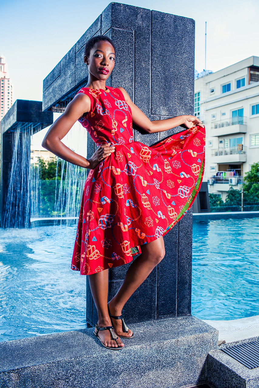 black model with african print dress